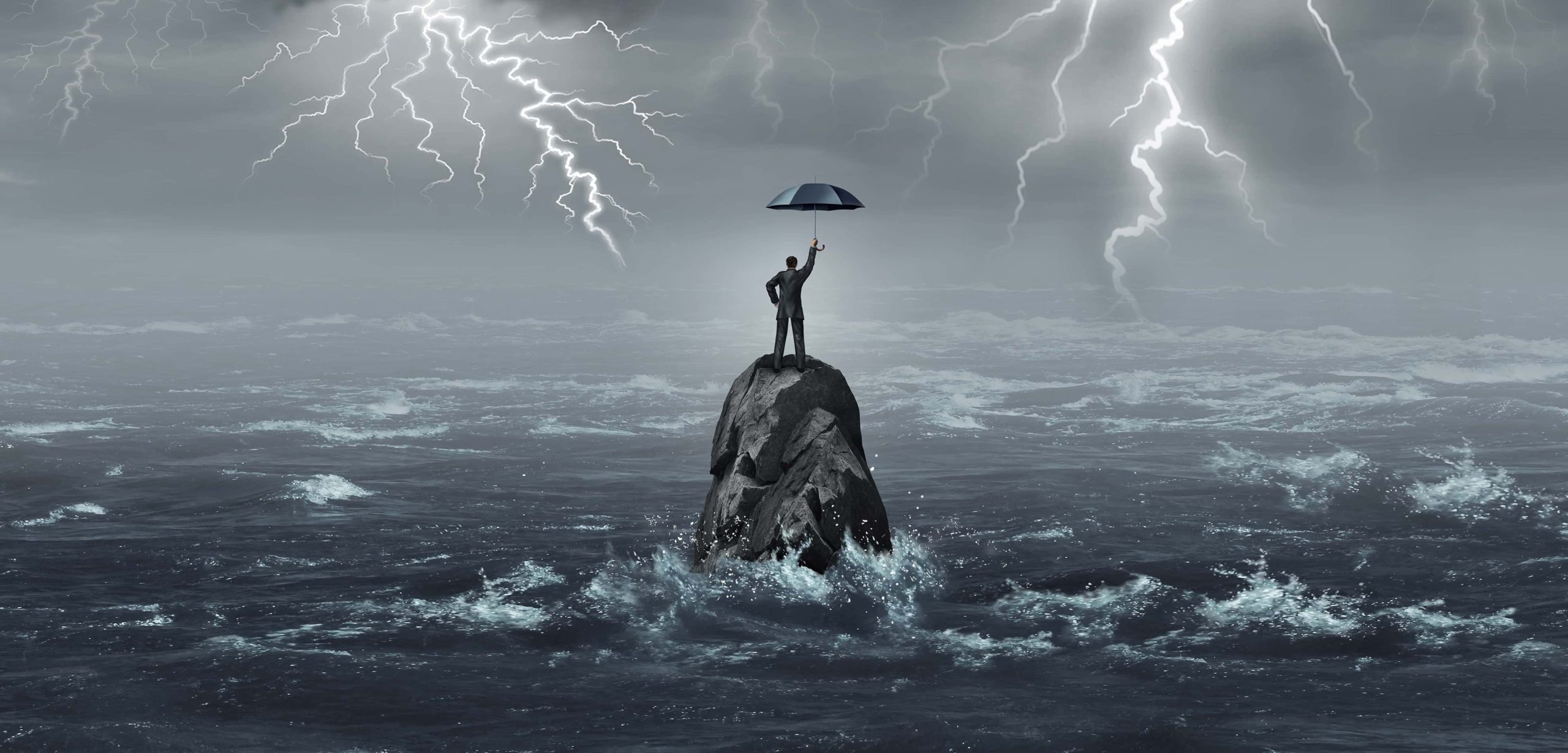 Man with umbrella standing in storm